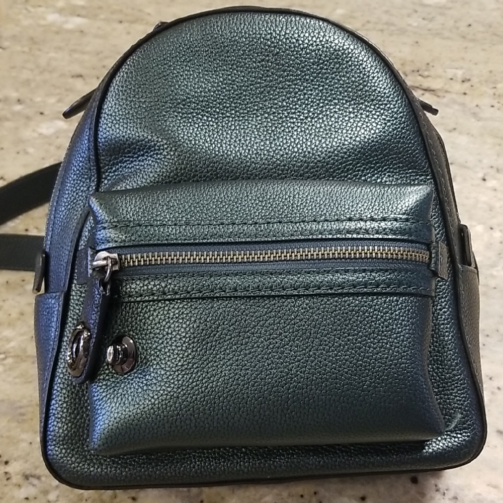 Coach Metallic Green Backpack with Textured Finish and Compact Design
